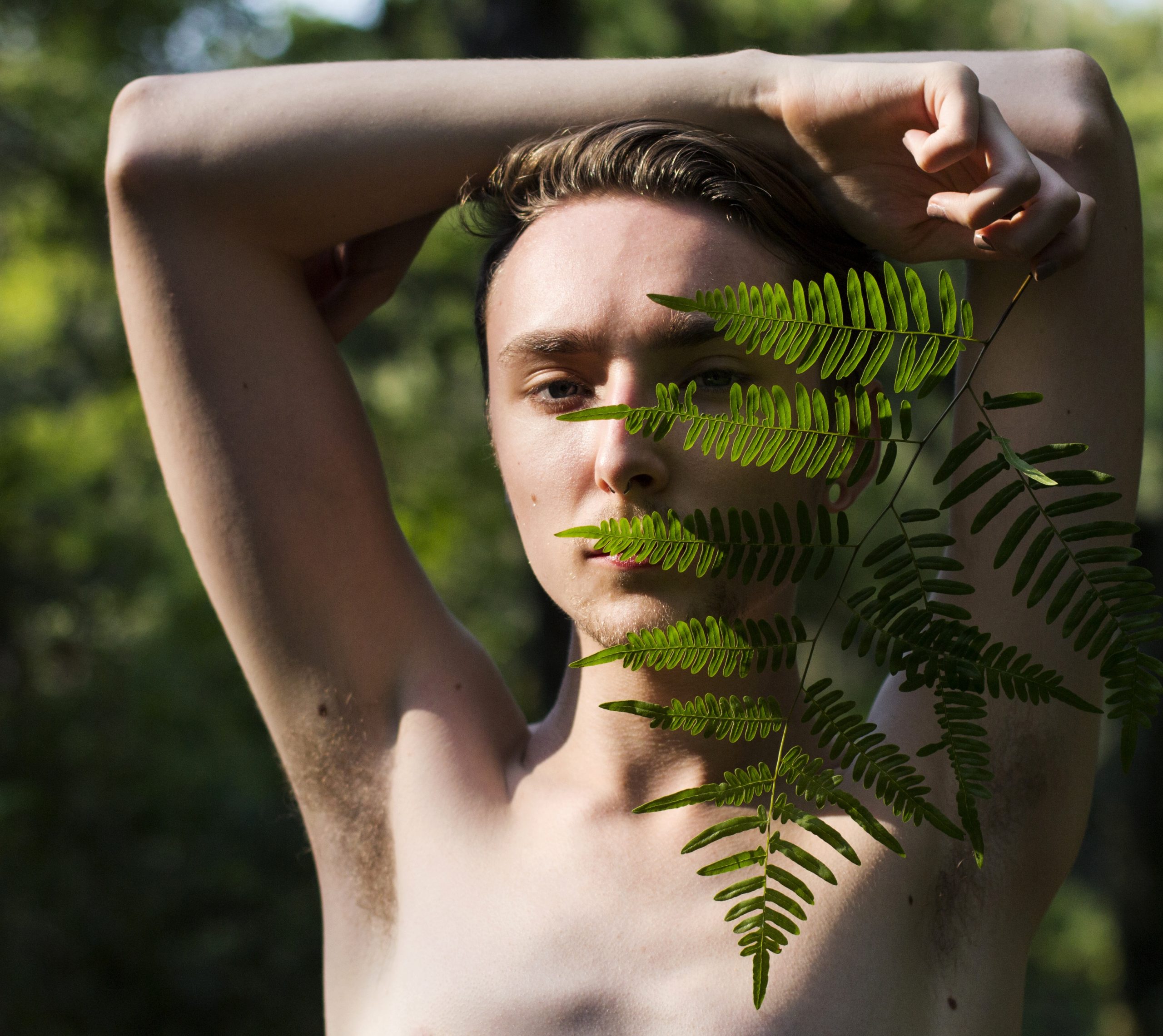 close-up-man-holding-leaf